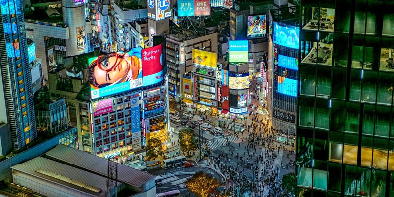 Screens and crowds at Shibuya Crossing in Tokyo